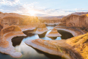 Ovewrhead view of Reflection Canyon, river bends and canyon gorge near Lake Powell at sunrise. Ovewrhead view of Reflection Canyon, river bends and canyon gorge near Lake Powell at sunrise.